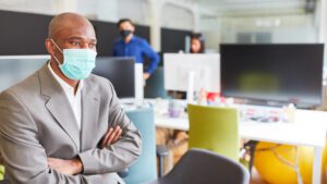 business man with mask on